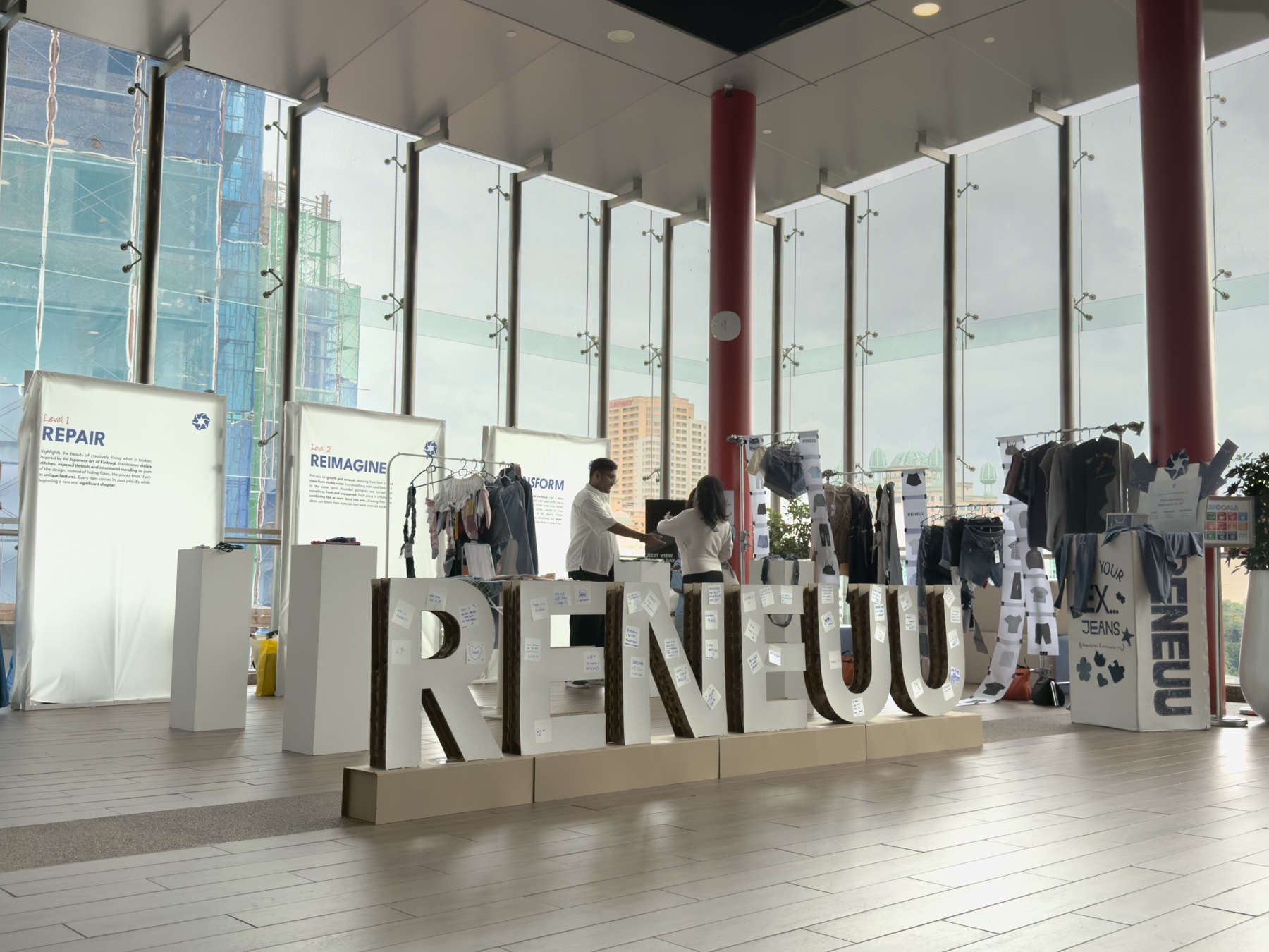 Visitors inside the RENEUU exhibition